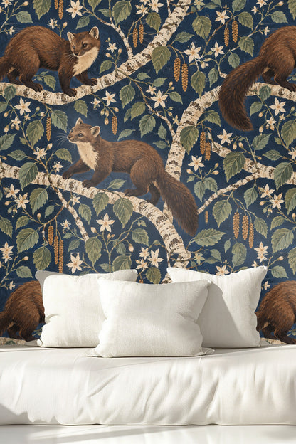 View of wallpaper designed in a naturalistic style with a dark indigo backdrop highlighting beige and green botanical motifs.