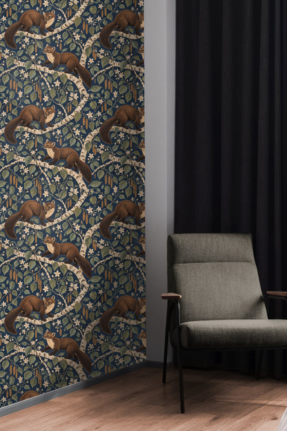 Living room with orange sofa and large Starry Birch Martens wallpaper mural featuring martens on birch branches with floral elements.