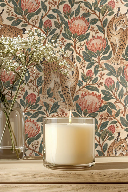 Laundry room with washing machine under window, wooden countertop, and shelves, framed by rust and green protea-lynx wallpaper.