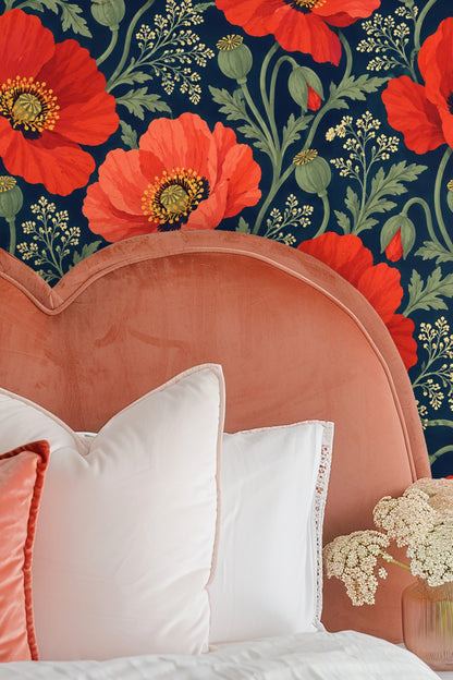 Living area highlighting the dynamic contrast of floral wallpaper with soft upholstery and natural stone table.