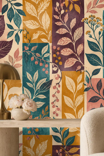 Living space corner with wallpaper showing varied leaf shapes and berry clusters
