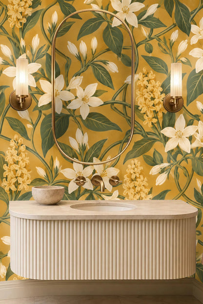 Wide view of bedroom with large scale floral wallpaper covering end wall