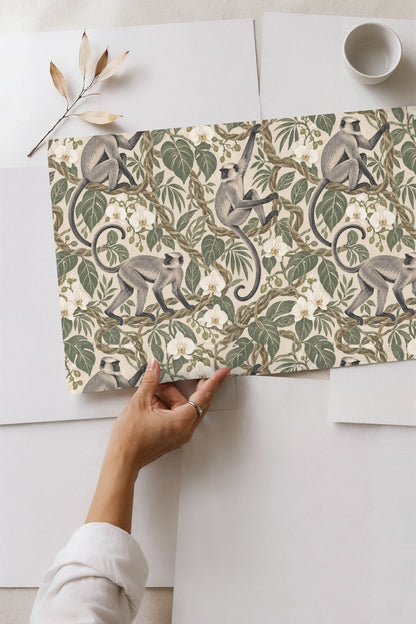 Close view of intertwined vines and leaves framing three langurs in naturalistic style.