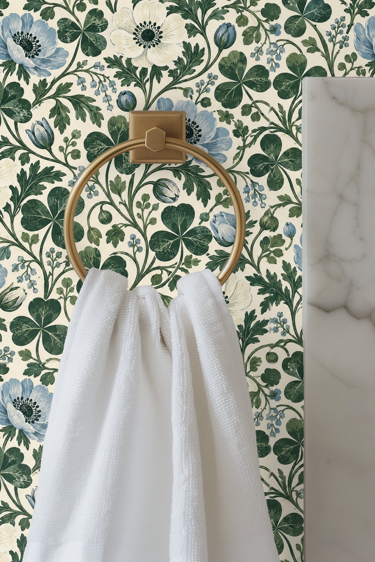 Entryway with arch and wooden doors framed by blue and cream anemone and clover wallpaper.