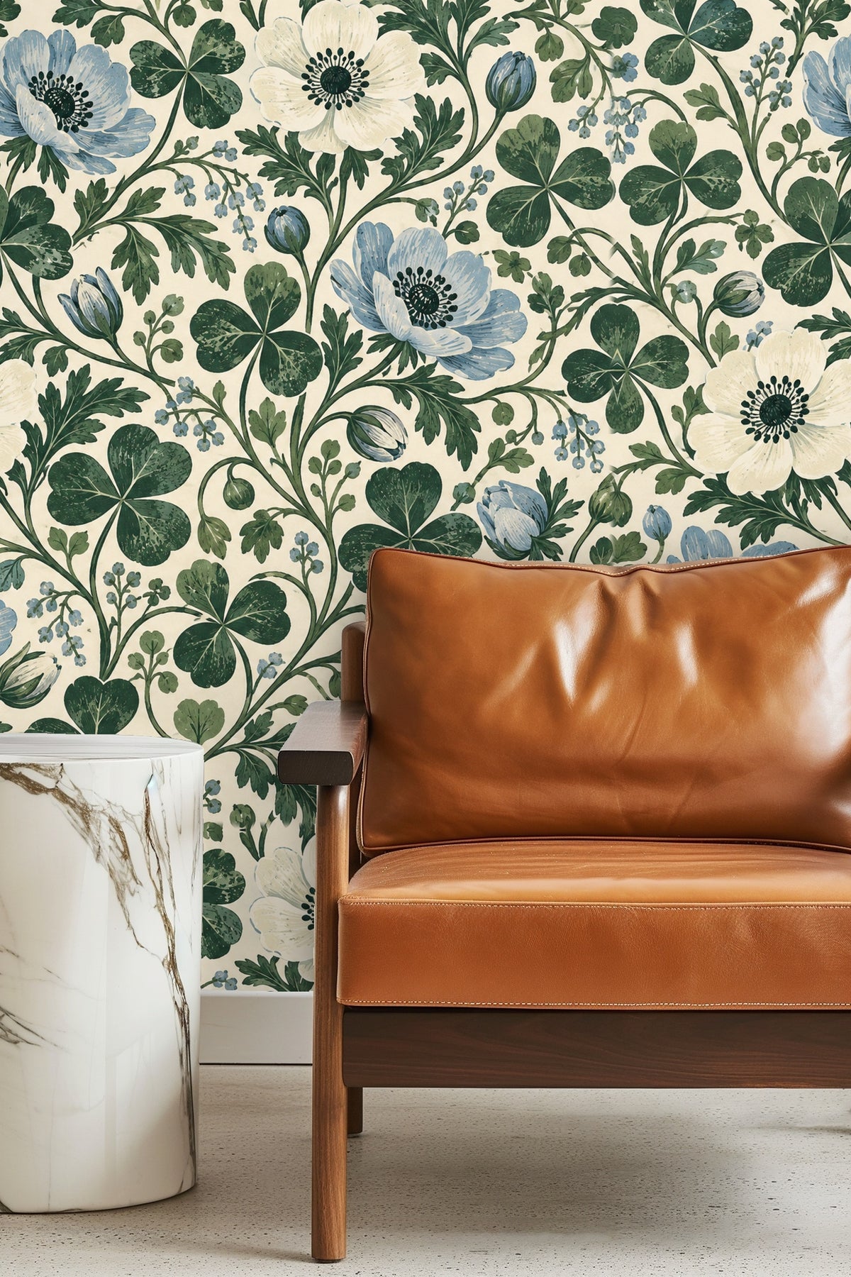 Close-up of blue anemone flower and clover leaves in wallpaper repeat.