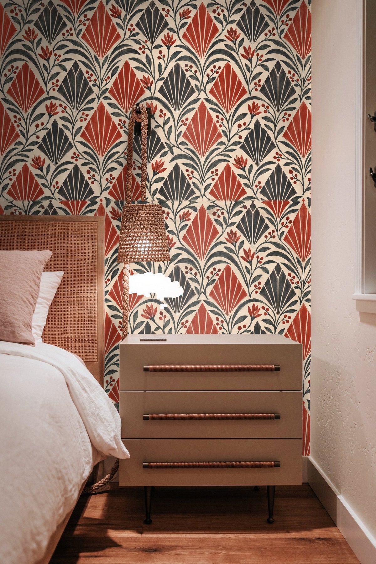 Living room with hanging rattan chair against wall covered in Crimson Apex Rhythm wallpaper