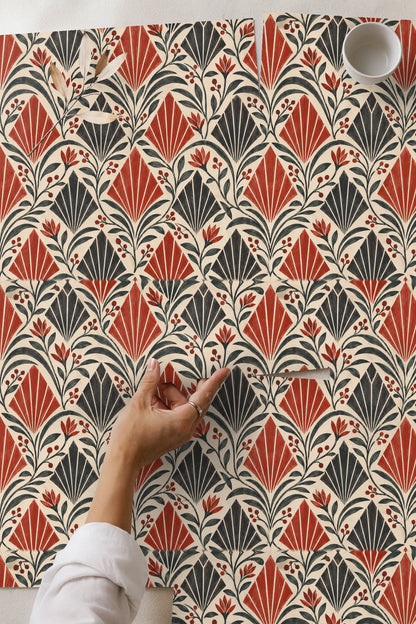 Bedroom bedside wall decorated with Crimson Apex Rhythm wallpaper, natural wicker furniture visible