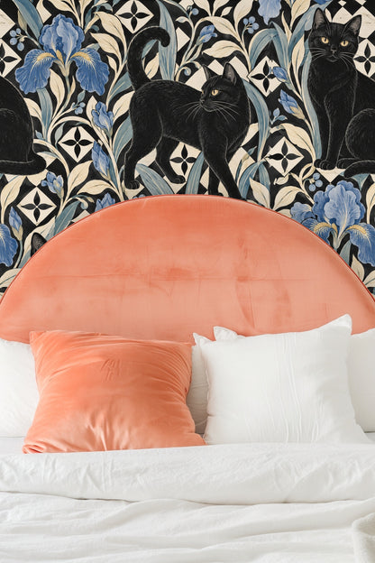 Interior bedside table and lamp in front of patterned wallpaper
