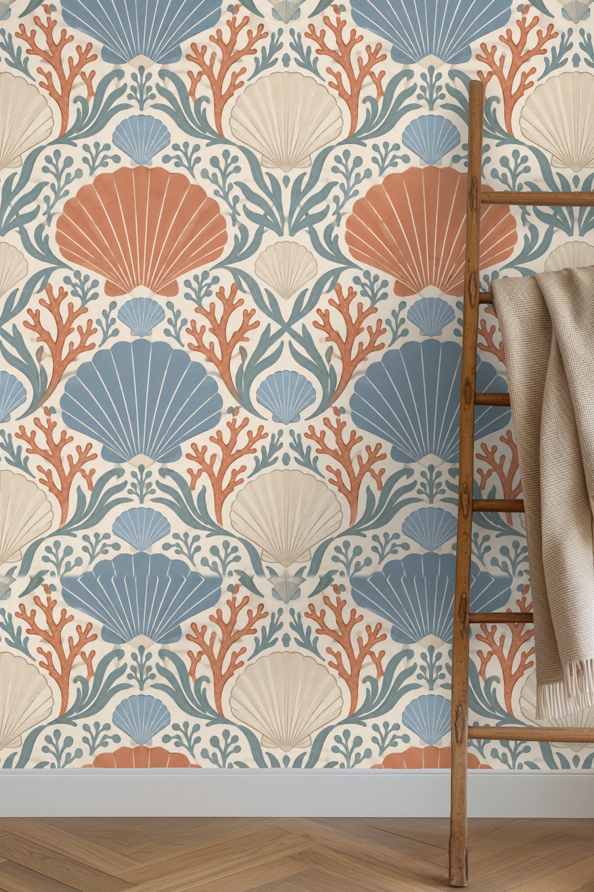 Bedroom with Coral Cove Crest wallpaper behind green velvet headboard and cream pillows on bed.