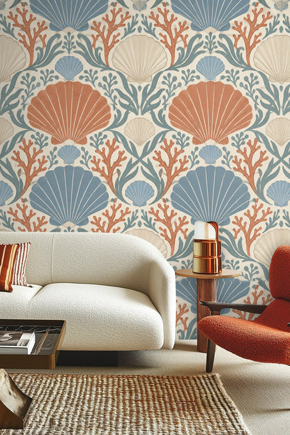 Close-up of scallop shells and coral motifs in Coral Cove Crest wallpaper palette of terracotta, blue, and cream.