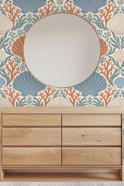 Shot of a bedroom corner featuring Coral Cove Crest wallpaper and soft natural light.