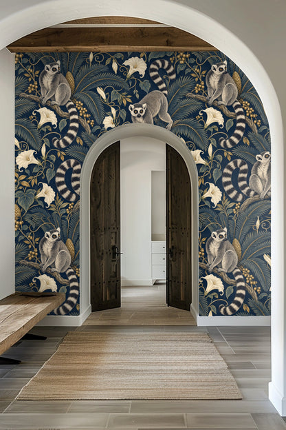 Laundry room featuring the wallpaper with ring-tailed lemurs and tropical plants behind a wooden countertop and white washers.