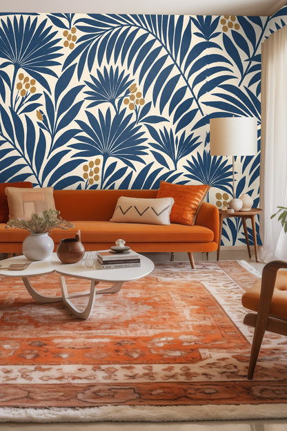 Golden berries clustered among navy palm fronds against an ivory wall