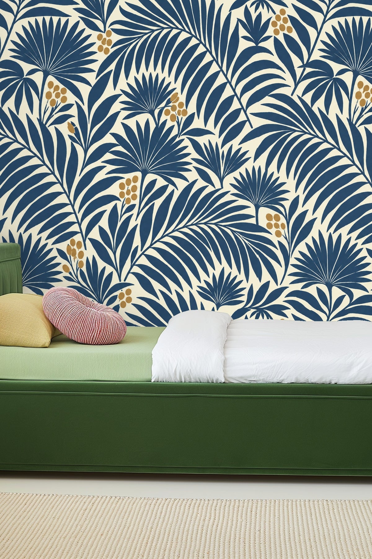 Stylized palm leaf branches creating a repeating pattern in indigo and gold