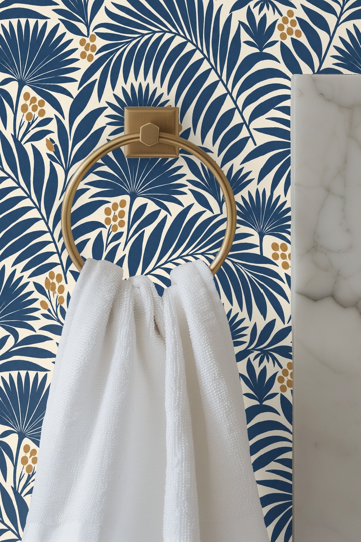Pattern of indigo blue palm leaves and golden berries on a cream background