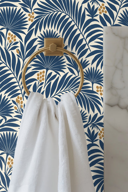 Pattern of indigo blue palm leaves and golden berries on a cream background