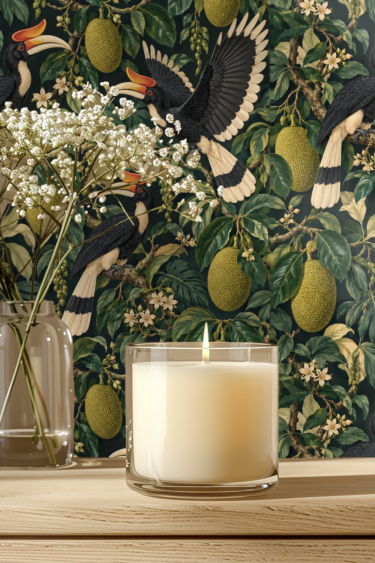Detailed wallpaper artwork showing three hornbills perched amid jackfruit and tropical foliage.
