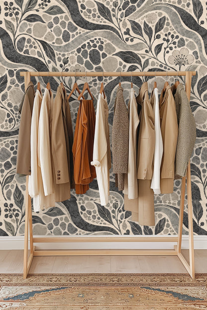 Room view showing wallpaper scale with flowing curves and clustered pebble textures.