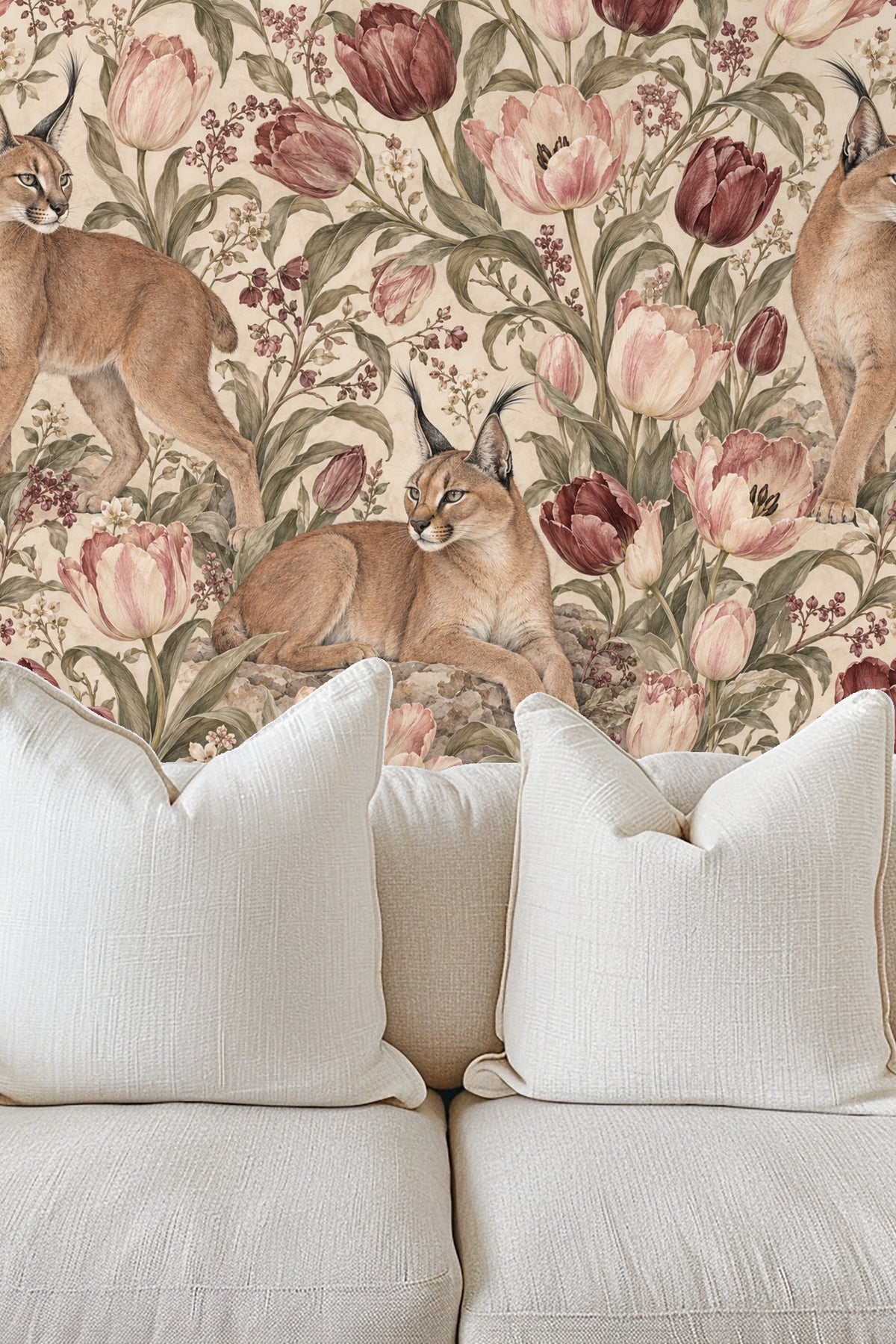 Lynx lying relaxed on rocks surrounded by tulips