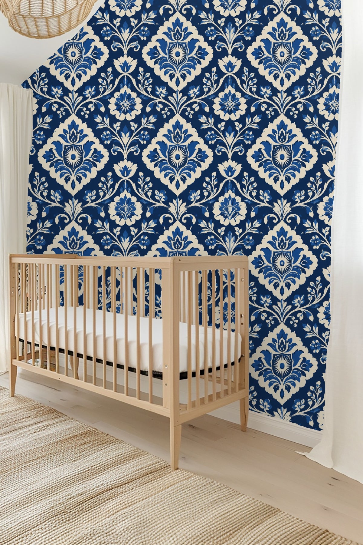 View of bedroom wall with wallpaper behind bedside lamp and pillow cushions.