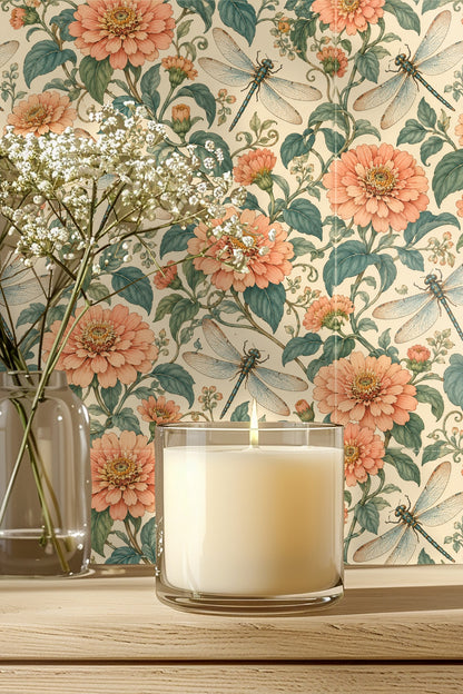 Detailed wallpaper pattern of peach zinnia flowers and dragonflies on cream background