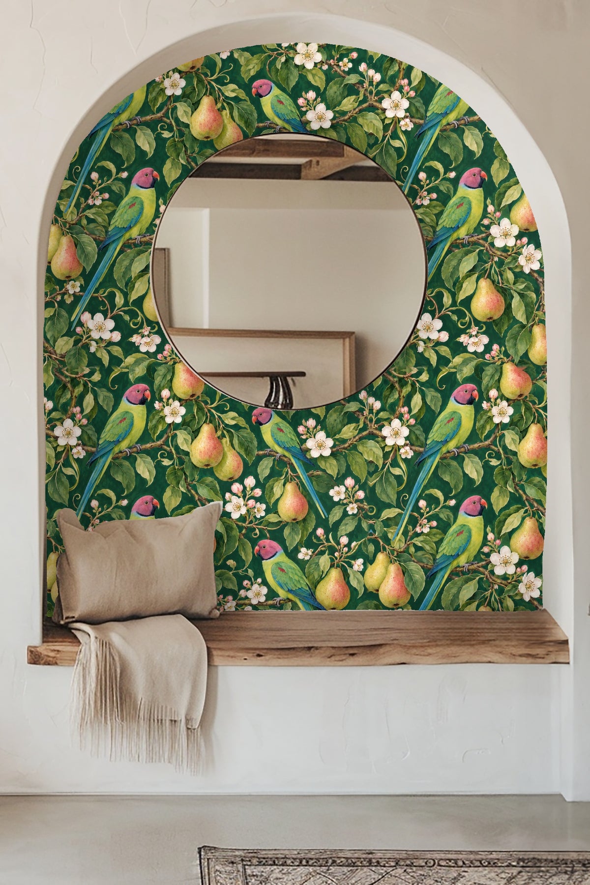 Living room featuring wallpaper with parakeets, pears, and white blossoms behind a blue velvet couch