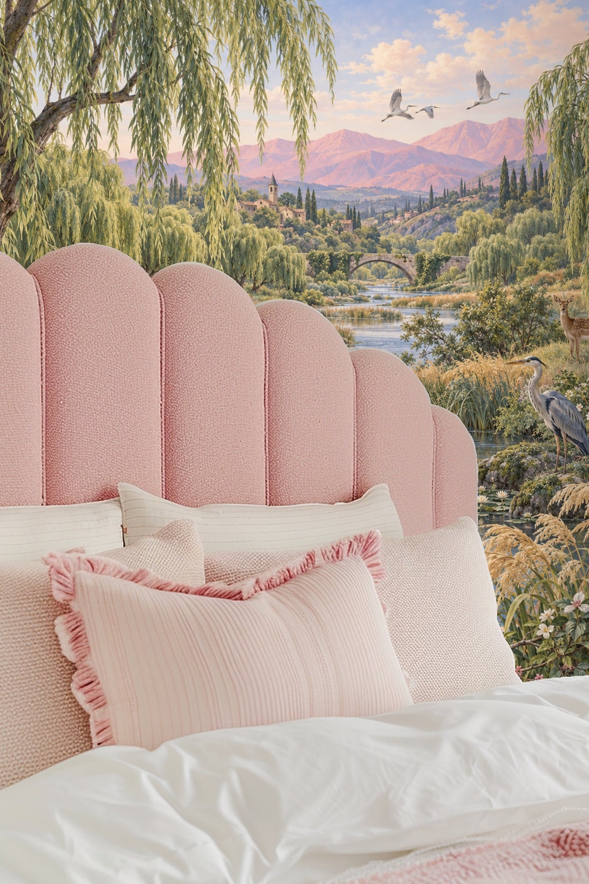 Pink-hued mountains under a partly cloudy sky in the background