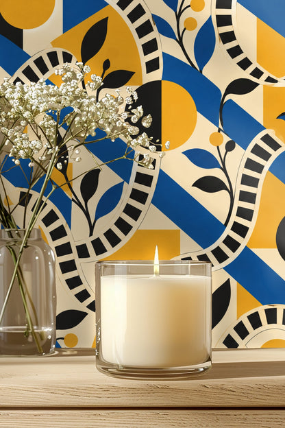 Bathroom medicine cabinet open to show wood shelves against wallpaper with bold blue, yellow, and black geometric shapes and black leaf and 