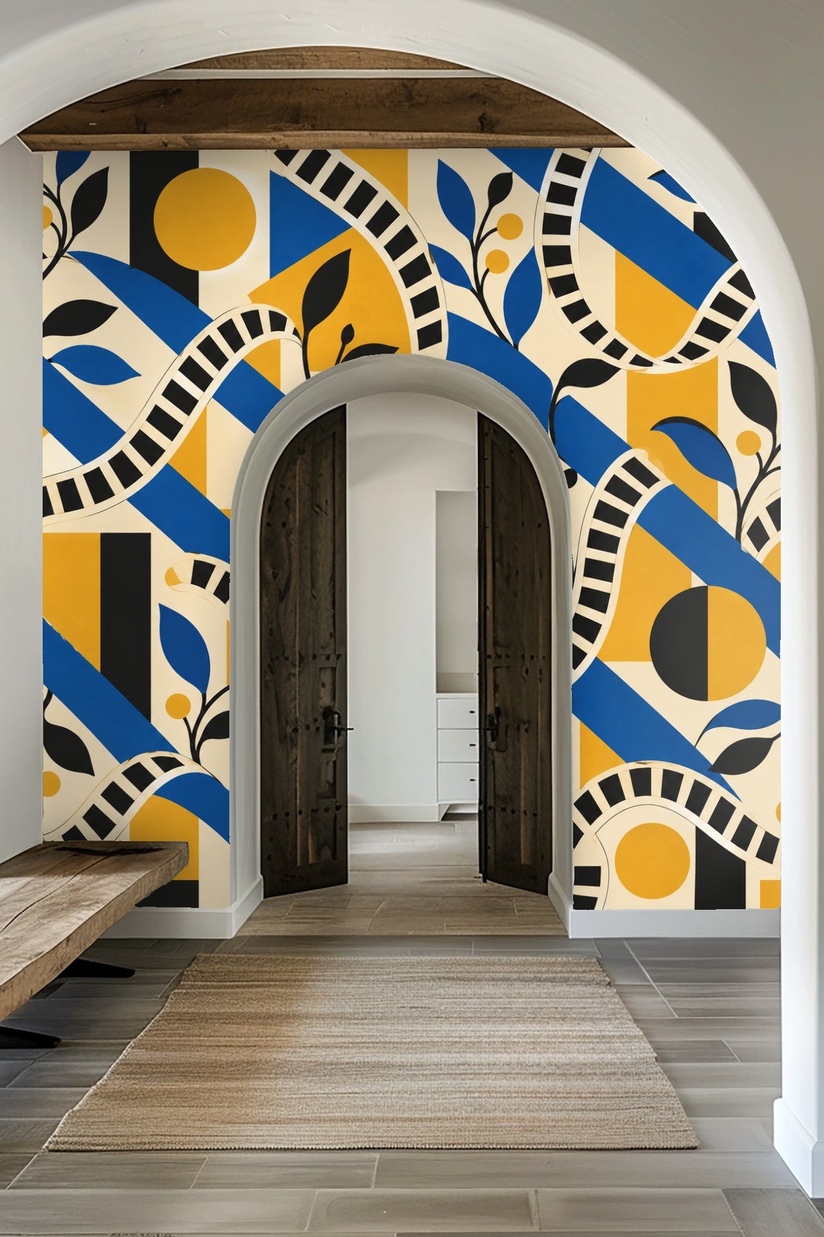 Decorative candle and baby’s breath flower close to wallpaper showing looping black and white striped pattern with blue, yellow, and black  