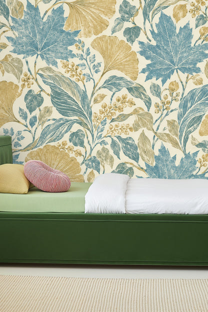 Detailed botanical print of pressed leaves and berries in blue, gold, and green on cream background