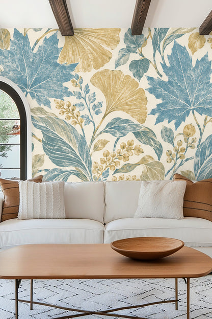 Living room with Pressed Leaf Canopy wallpaper, modern white sofa, rust orange chair, and wooden side table