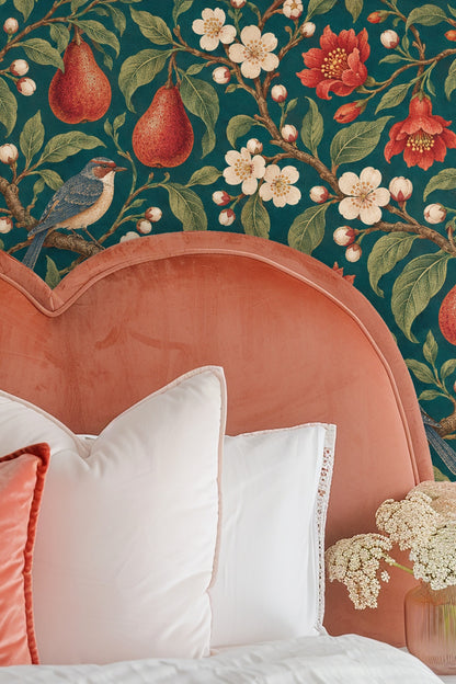 Wallpaper artwork featuring red pears, pomegranates, white blossoms, green leaves, and birds on a deep petrol blue background.