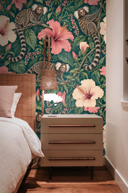 Room with hanging white wicker chair and wall of petrol hibiscus and marmoset wallpaper