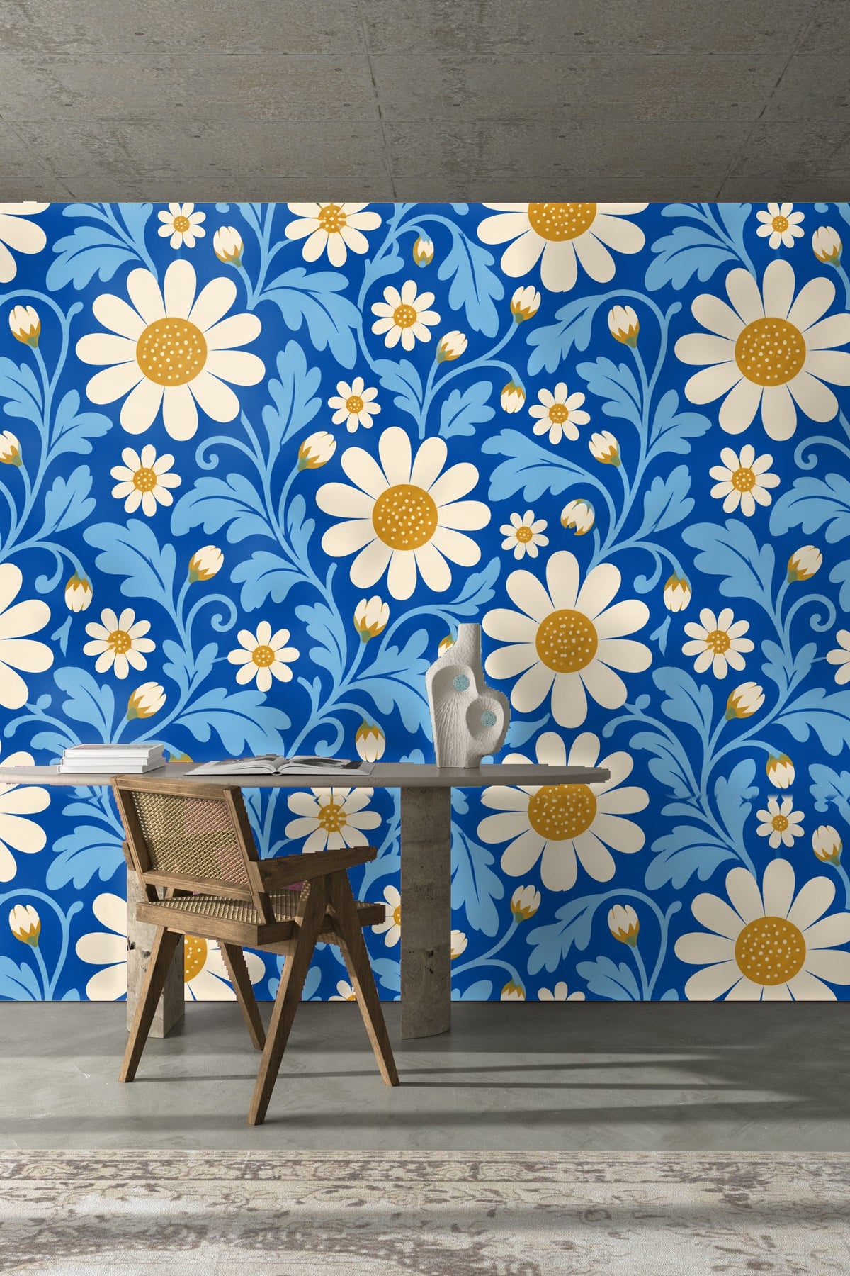 Blue couch cushion against matching cerulean floral wallpaper