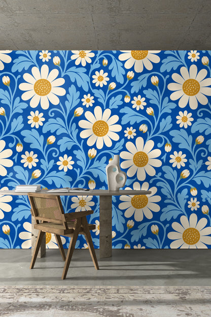 Blue couch cushion against matching cerulean floral wallpaper