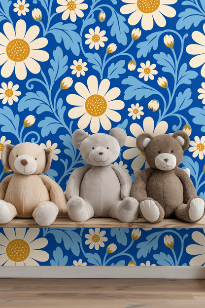Detailed shot of daisy buds and leaves on vibrant blue wallpaper