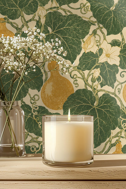 Wallpaper close-up showing stylized golden gourds, green leaves, and cream flowers on a neutral background.