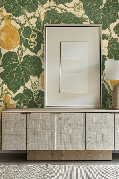 Moss Ribbon Gourds wallpaper in a bathroom setting with a white towel hanging on a matte gold ring and marble wall corner. 