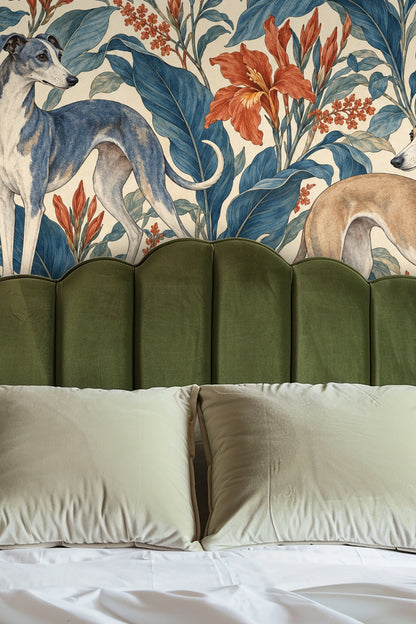 Azure Canna Whippets wallpaper behind a blue velvet couch showing the intricate botanical and canine pattern