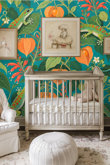 Living room wall with wallpaper featuring green geckos, coral gooseberry pods, and red flowers behind pink curved sofa