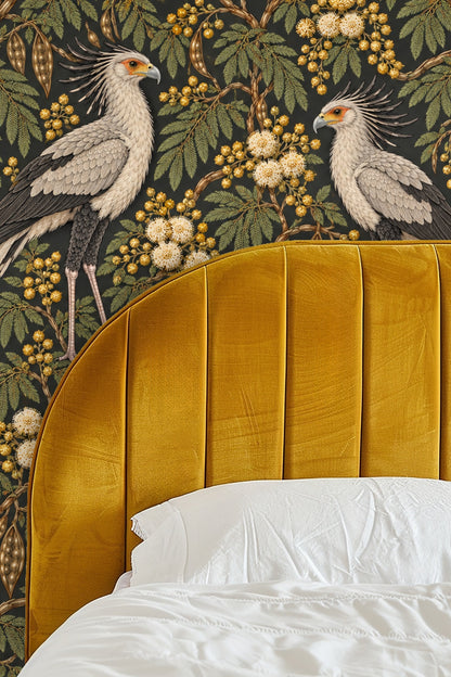 Bedroom view with wooden furniture and textured textiles against Bronze Secretary Birds wallpaper