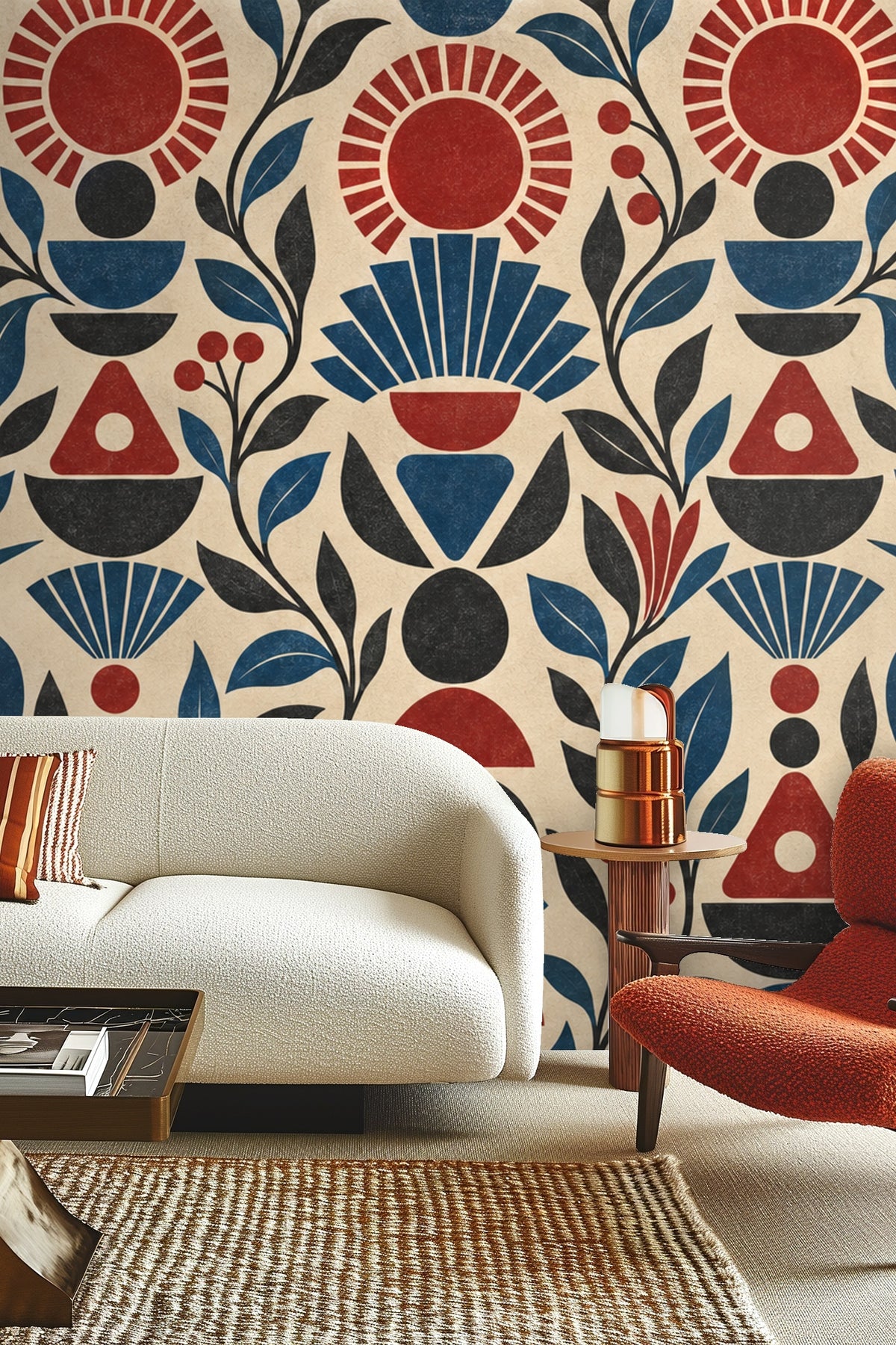 Pattern detail of Ruby Sunstack wallpaper showing stylized suns and foliage in red, blue, and black on beige