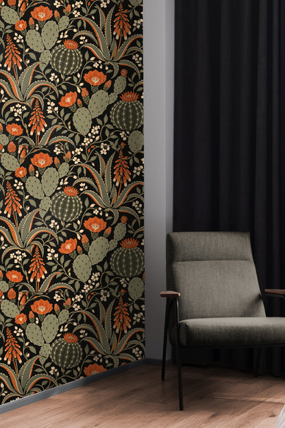 Peach velvet headboard bed with pillows against Spiced Cactus Bloom wallpaper featuring stylized cacti and burnt orange blooms