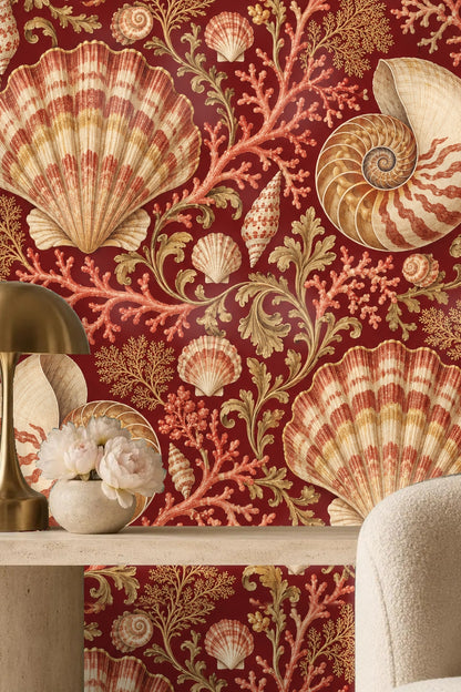 Baroque floral and seashell wallpaper in rich claret palette.