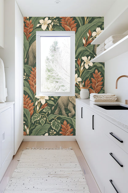 Side view of an elephant with raised trunk surrounded by creamy lilies and tropical leaves in the wallpaper