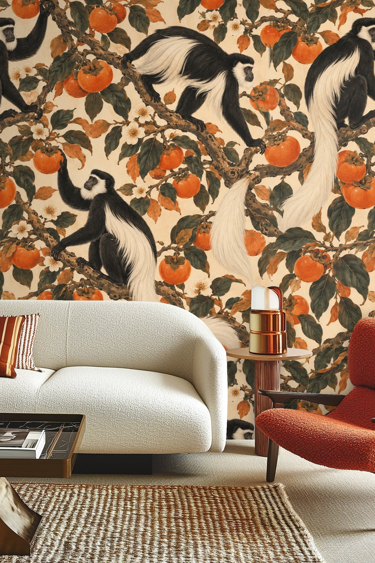 Wallpaper artwork detail showing black-and-white colobus monkeys among orange persimmons and green foliage