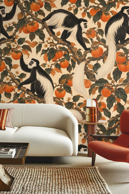 Wallpaper artwork detail showing black-and-white colobus monkeys among orange persimmons and green foliage