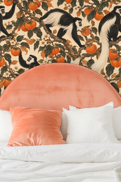 Living space featuring the wallpaper with a green velvet sofa, red velvet stool, and modern wall art