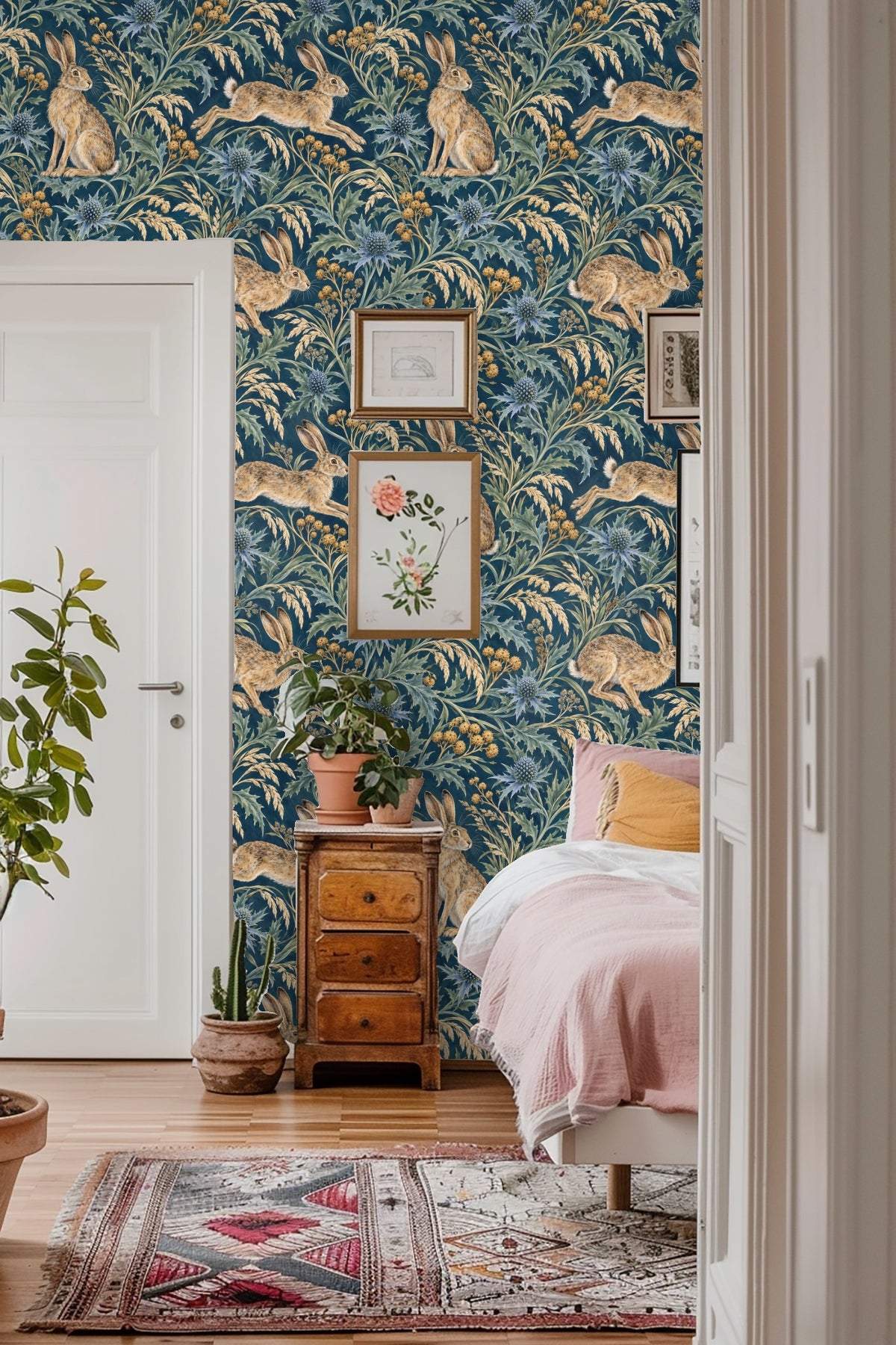 Wallpaper detail showing a hare sitting amid spiky sea holly and golden wild grasses