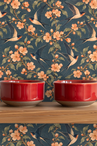 Wallpaper shown behind plush blue sofa with piping detail